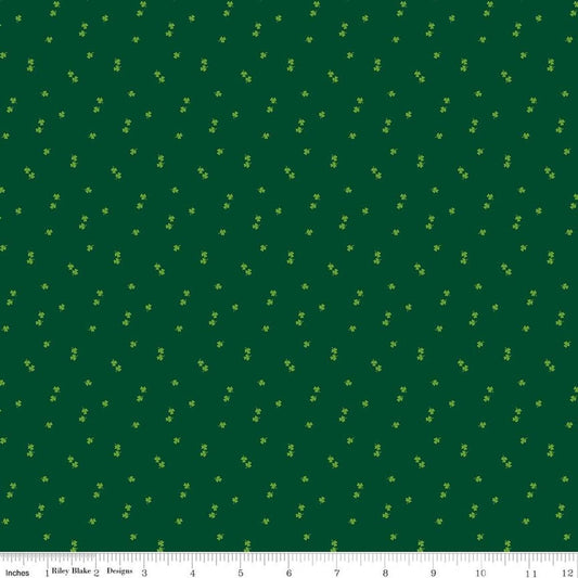 Image of Seasonal Basics Clovers Green quilting cotton fabric by Christopher Thompson for Riley Blake Designs. Features clovers on a green background. Cute Little Fabric Shop.