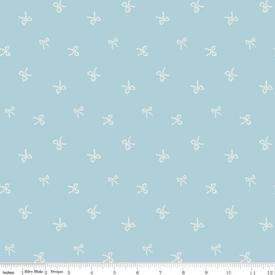 Image of Designer Flannel Sweet Cotton Tales Bows Blue quilting cotton fabric by Little Forest Atelier for RIley Blake Designs. Features bows on a blue background. Cute Little Fabric Shop.