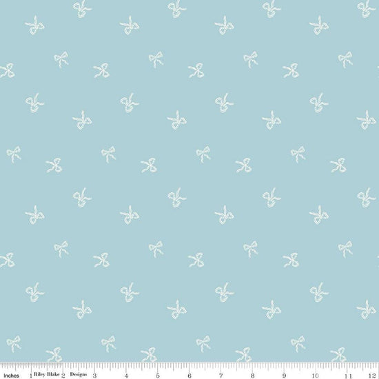 Image of Designer Flannel Sweet Cotton Tales Bows Blue quilting cotton fabric by Little Forest Atelier for RIley Blake Designs. Features bows on a blue background. Cute Little Fabric Shop.