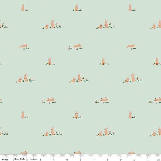 Image of Designer Flannel Sweet Cotton Tales Flopsy Fields Mint quilting cotton fabric by Little Forest Atelier for RIley Blake Designs. Features bunnies on a green background. Cute Little Fabric Shop.
