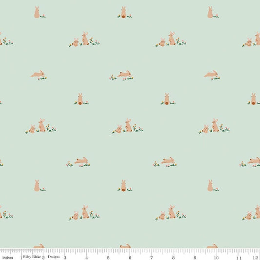 Image of Designer Flannel Sweet Cotton Tales Flopsy Fields Mint quilting cotton fabric by Little Forest Atelier for RIley Blake Designs. Features bunnies on a green background. Cute Little Fabric Shop.