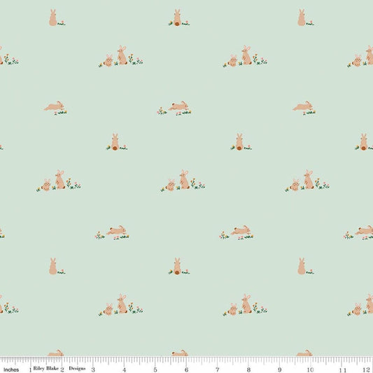 Image of Designer Flannel Sweet Cotton Tales Flopsy Fields Mint quilting cotton fabric by Little Forest Atelier for RIley Blake Designs. Features bunnies on a green background. Cute Little Fabric Shop.