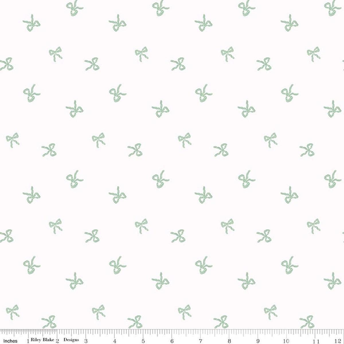 Image of Designer Flannel Sweet Cotton Tales Bows White quilting cotton fabric by Little Forest Atelier for RIley Blake Designs. Features bows on a white background. Cute Little Fabric Shop.