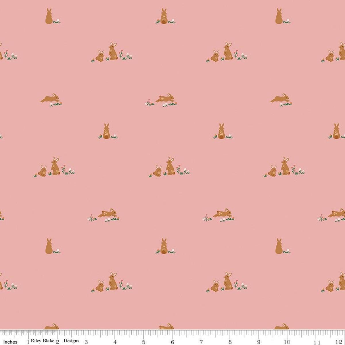 Image of Designer Flannel Sweet Cotton Tales Flopsy Fields Pink quilting cotton fabric by Little Forest Atelier for RIley Blake Designs. Features bunnies on a pink background. Cute Little Fabric Shop.