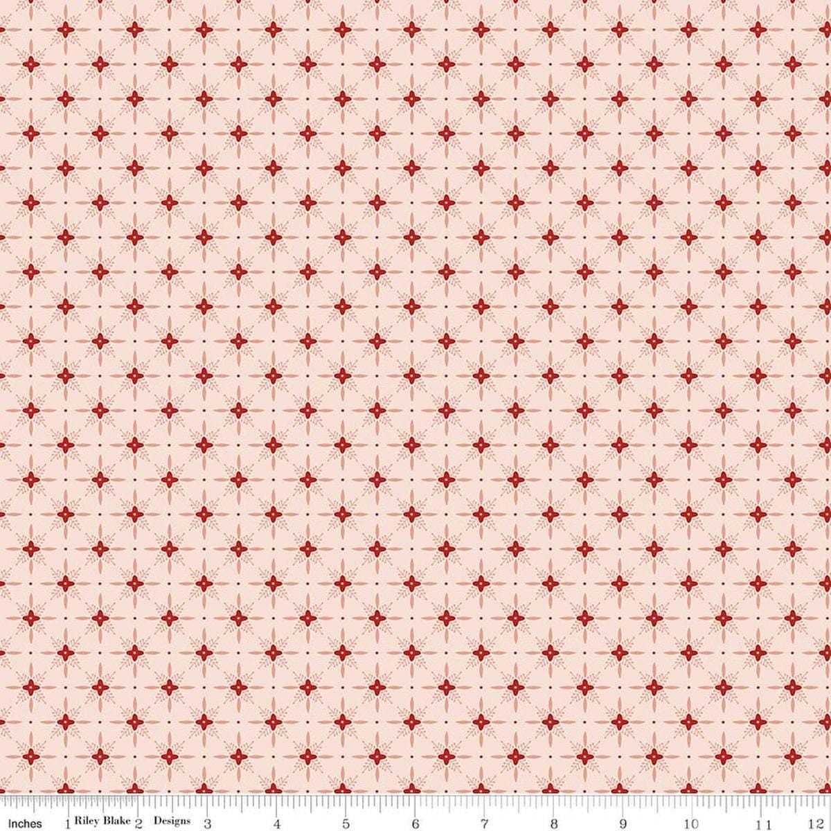 Image of Christmas Greetings Twinkle Pink quilting cotton fabric by Sandy Gervais for Riley Blake Designs. Features a geometric pattern on a pink background. Cute Little Fabric Shop.