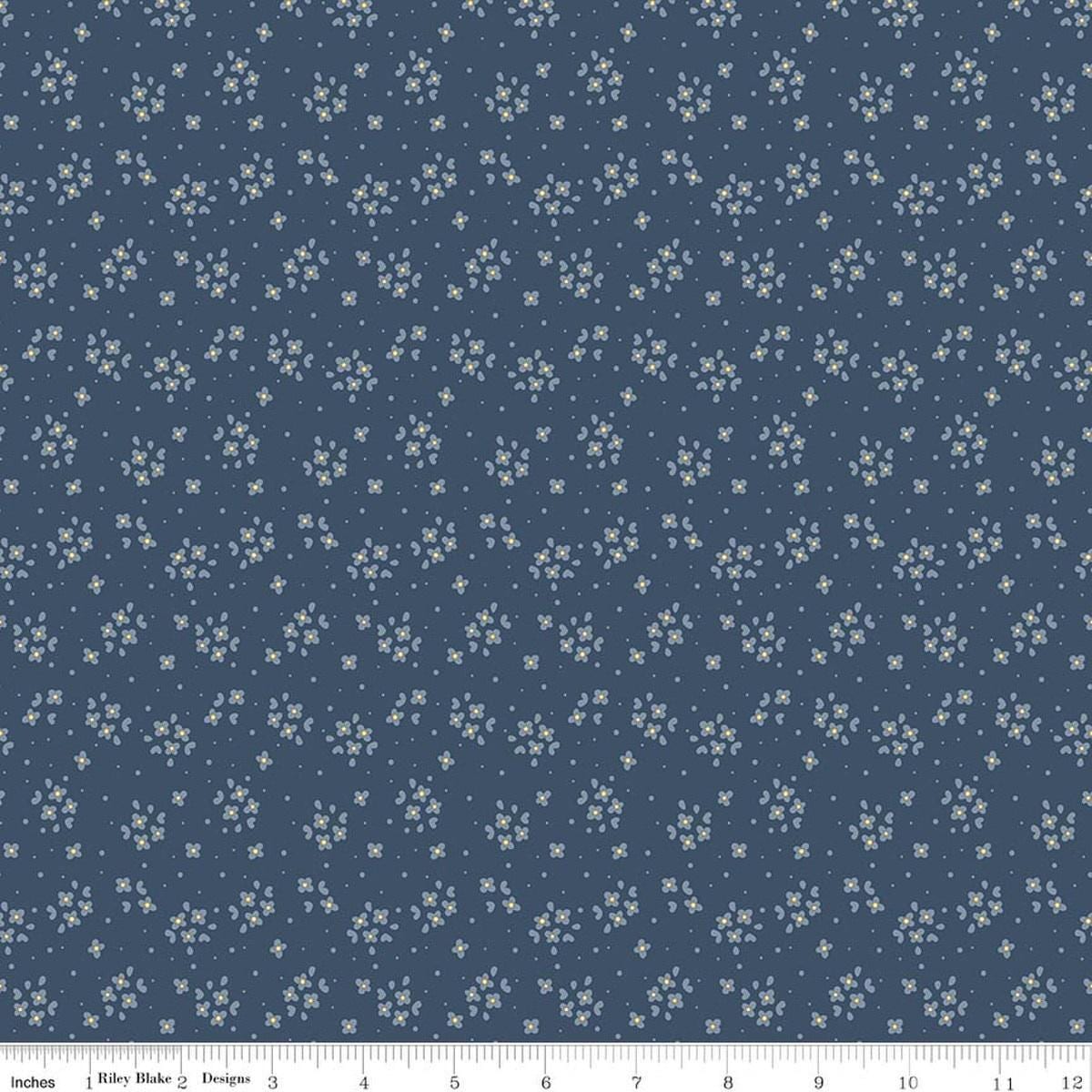 Image of Rosewood Posy Oxford quilting cotton fabric by Jessica Chertkow for Riley Blake Designs. Features flowers on a blue background. Cute Little Fabric Shop.