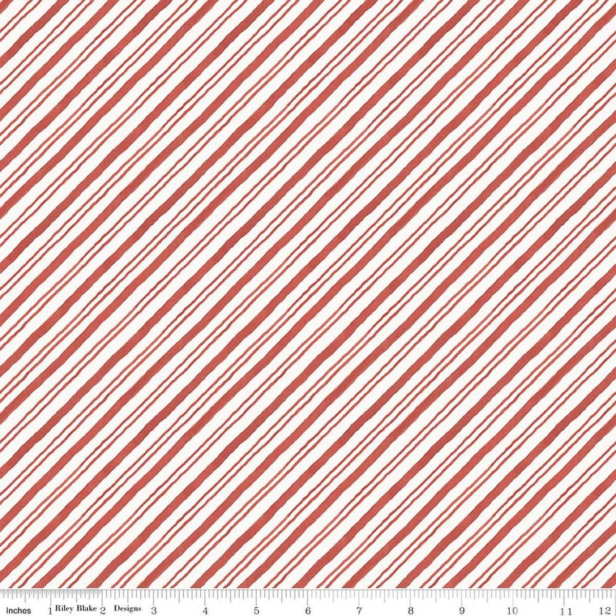 Image of Holiday Spirit Stripes Red quilting cotton fabric by Lisa Audit for Riley Blake Designs. Features stripes on a red background. Cute Little Fabric Shop.