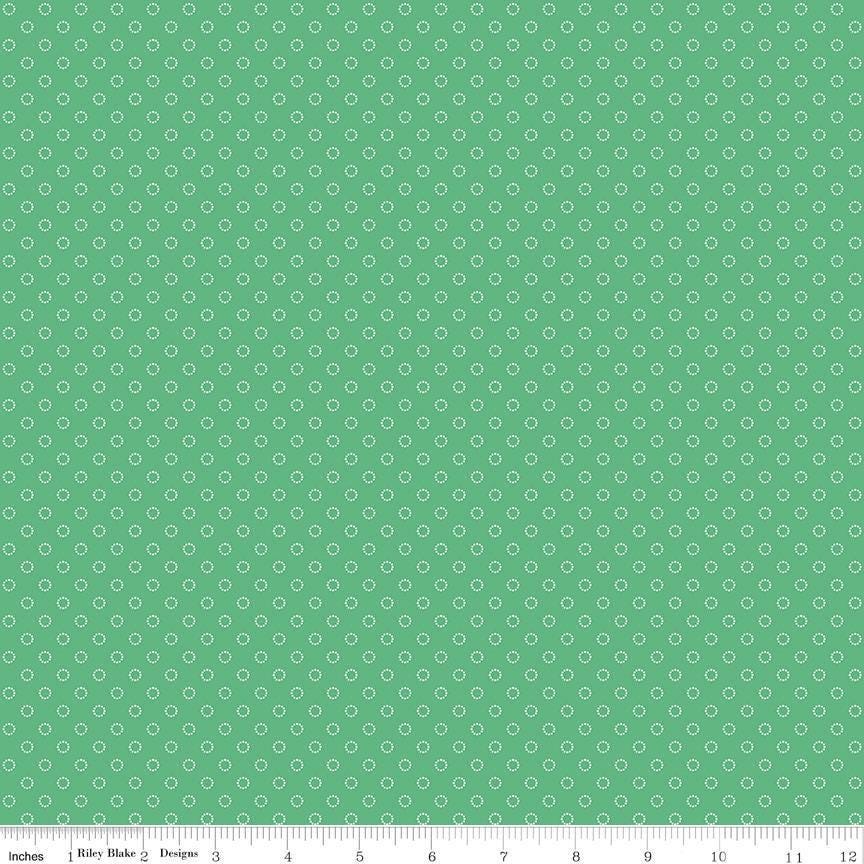 Image of Whimsical Woodland Circle Dots Green quilting cotton fabric by Tasha Noel for Riley Blake Designs. Features dots on a green background. Cute Little Fabric Shop.