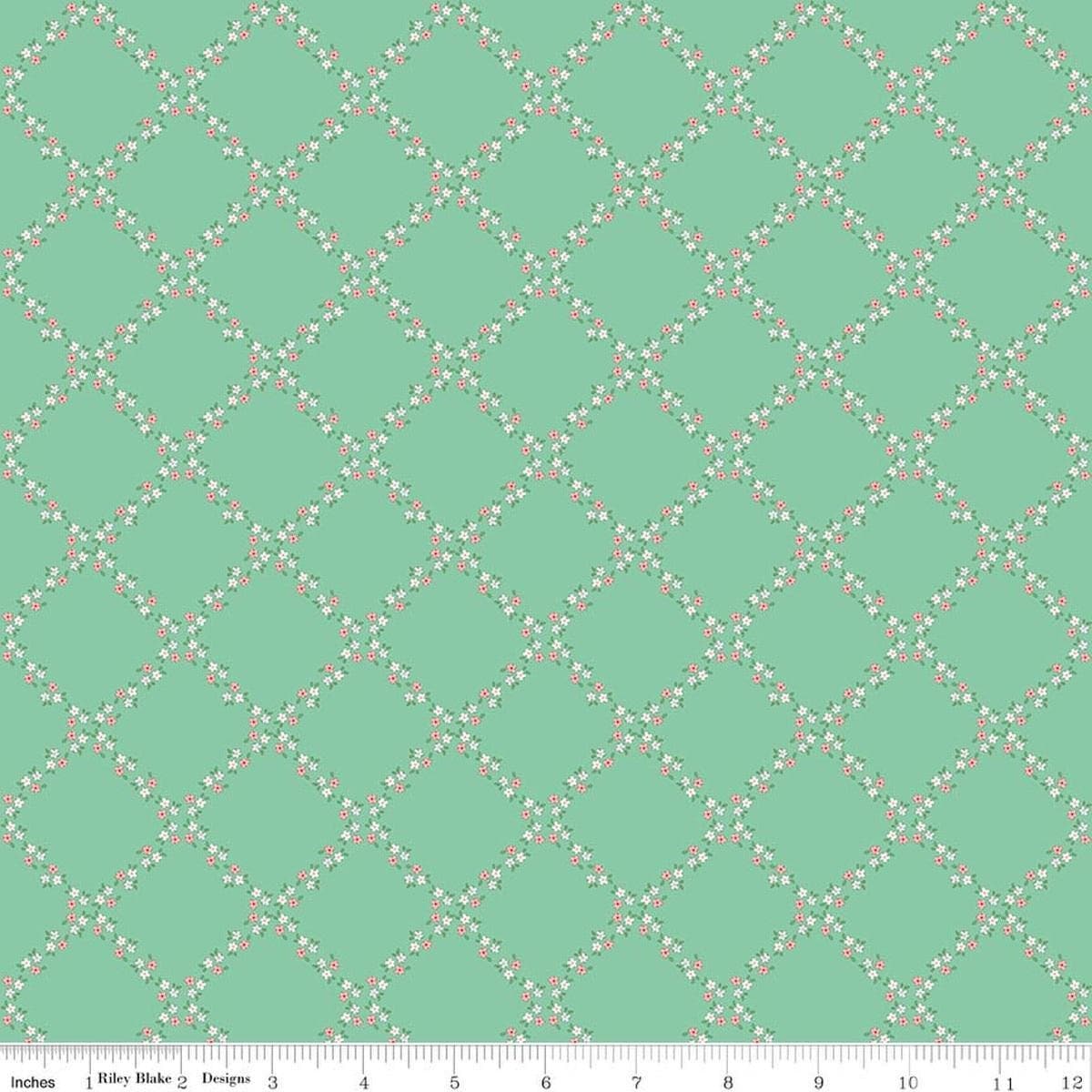 Image of Whimsical Woodland Lattice Green quilting cotton fabric by Tasha Noel for Riley Blake Designs. Features flowers on a green background. Cute Little Fabric Shop.