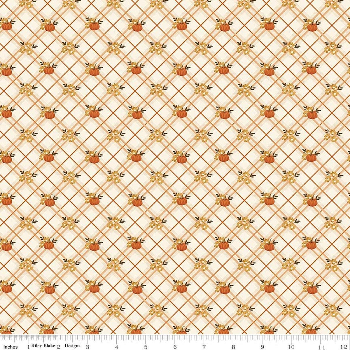 Image of Bountiful Pumpkin Plaid Cream quilting cotton fabric by Sandy Gervais for Riley Blake Designs. Features pumpkins and plaid on a cream background. Cute Little Fabric Shop.
