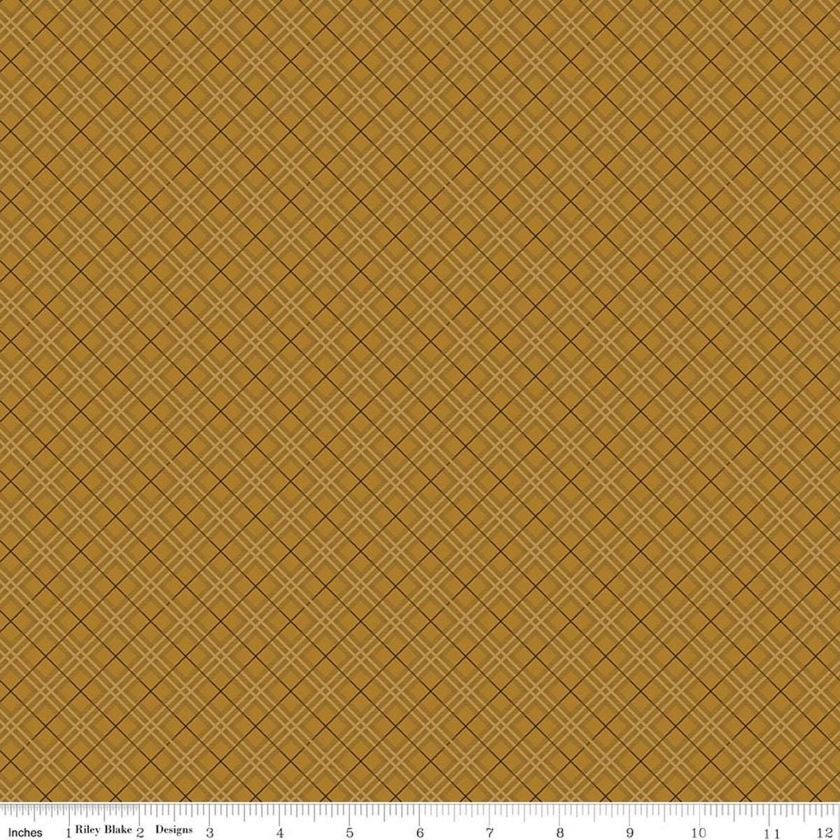 Image of Bountiful Plaid Butterscotch quilting cotton fabric by Sandy Gervais for Riley Blake Designs. Features plaid on a brown background. Cute Little Fabric Shop.