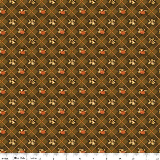 Image of Bountiful Pumpkin Plaid Suede quilting cotton fabric by Sandy Gervais for Riley Blake Designs. Features pumpkins and plaid on a brown background. Cute Little Fabric Shop.