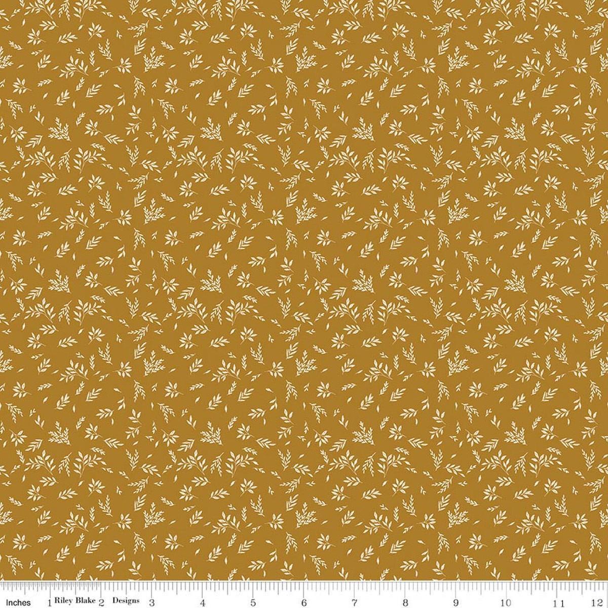Image of Bountiful Leaves Butterscotch quilting cotton fabric by Sandy Gervais for Riley Blake Designs. Features leaves on a yellow background. Cute Little Fabric Shop.