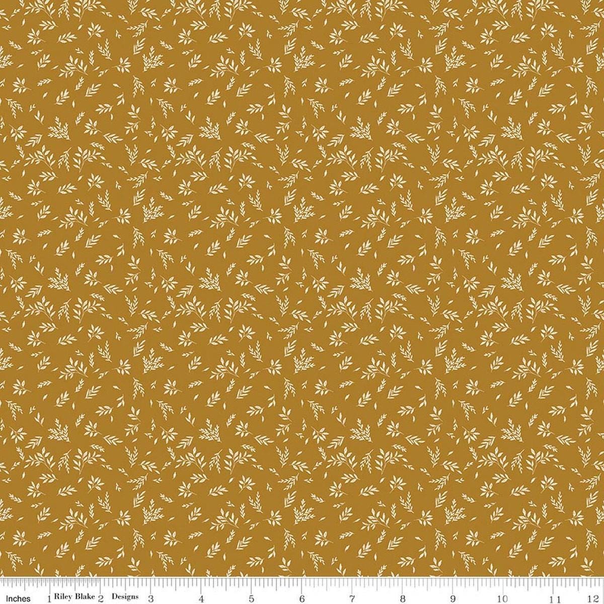 Image of Bountiful Leaves Butterscotch quilting cotton fabric by Sandy Gervais for Riley Blake Designs. Features leaves on a yellow background. Cute Little Fabric Shop.