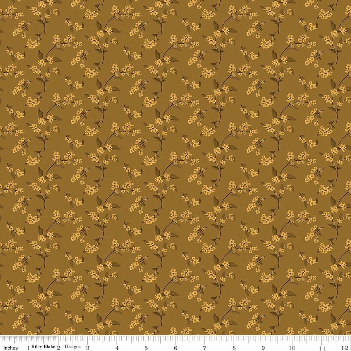 Image of Bountiful Bittersweet Suede quilting cotton fabric by Sandy Gervais for Riley Blake Designs. Features flowers on a brown background. Cute Little Fabric Shop.