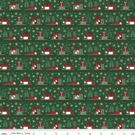 Image of Christmas Time Sleds Forest quilting cotton fabric by Dani Mogstad for Riley Blake Designs. Features presents on a green background. Cute Little Fabric Shop.