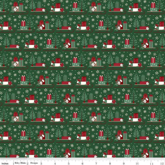 Image of Christmas Time Sleds Forest quilting cotton fabric by Dani Mogstad for Riley Blake Designs. Features presents on a green background. Cute Little Fabric Shop.