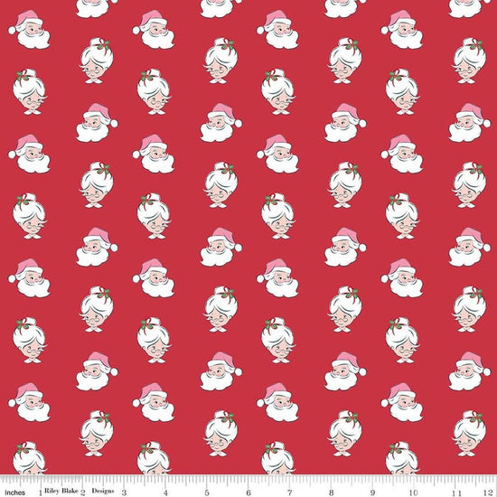 Image of Claus & Co. Santa Heads Red quilting cotton fabric by Melissa Mortenson for Riley Blake Designs. Features santa heads on a red background. Cute Little Fabric Shop.