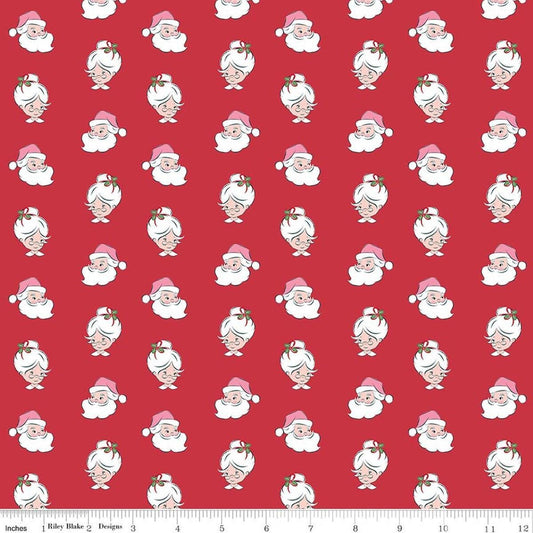 Image of Claus & Co. Santa Heads Red quilting cotton fabric by Melissa Mortenson for Riley Blake Designs. Features santa heads on a red background. Cute Little Fabric Shop.