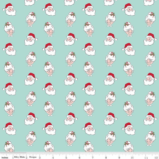 Image of Claus & Co. Santa Heads Blue quilting cotton fabric by Melissa Mortenson for Riley Blake Designs. Features santa heads on a blue background. Cute Little Fabric Shop.