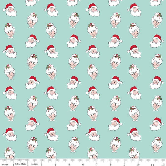 Image of Claus & Co. Santa Heads Blue quilting cotton fabric by Melissa Mortenson for Riley Blake Designs. Features santa heads on a blue background. Cute Little Fabric Shop.