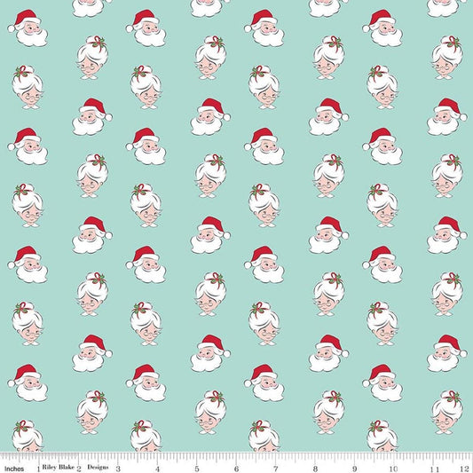 Image of Claus & Co. Santa Heads Blue quilting cotton fabric by Melissa Mortenson for Riley Blake Designs. Features santa heads on a blue background. Cute Little Fabric Shop.