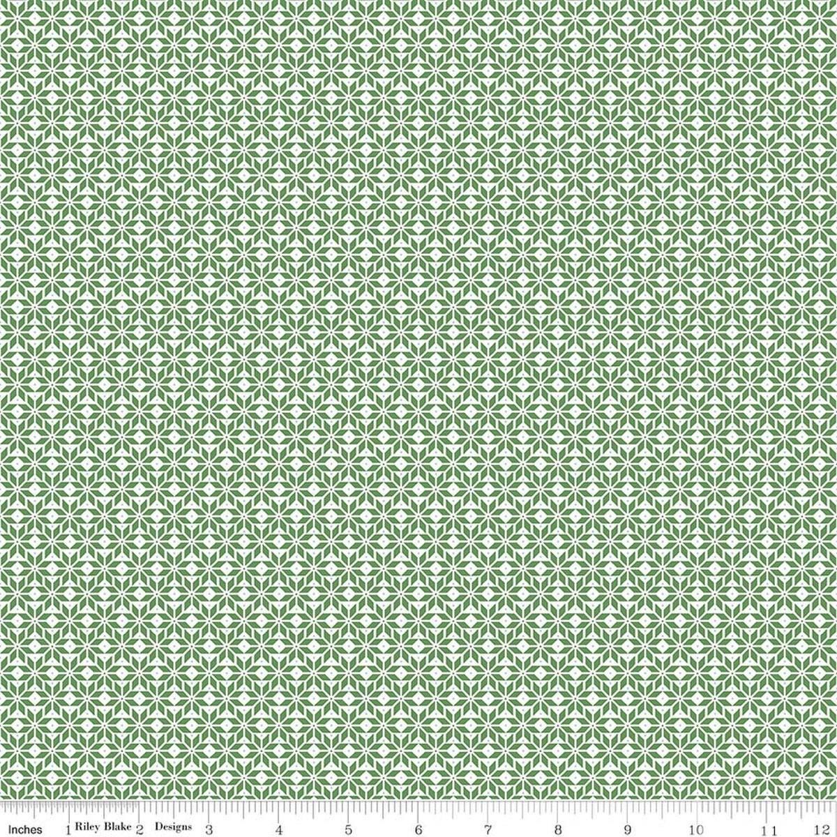 Image of Claus & Co. Star Pattern Green quilting cotton fabric by Melissa Mortenson for Riley Blake Designs. Features stars on a green background. Cute Little Fabric Shop.