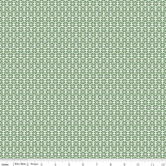 Image of Claus & Co. Star Pattern Green quilting cotton fabric by Melissa Mortenson for Riley Blake Designs. Features stars on a green background. Cute Little Fabric Shop.
