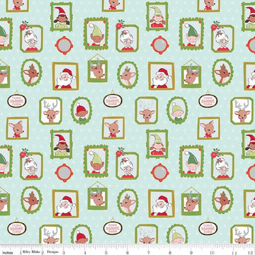 Image of Claus & Co. Wallpaper Blue Sparkle quilting cotton fabric by Melissa Mortenson for Riley Blake Designs. Features pictures on a blue background. Cute Little Fabric Shop.