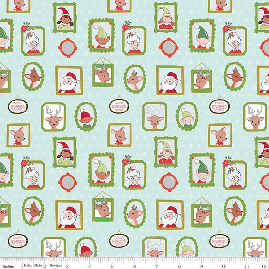 Image of Claus & Co. Wallpaper Blue Sparkle quilting cotton fabric by Melissa Mortenson for Riley Blake Designs. Features pictures on a blue background. Cute Little Fabric Shop.