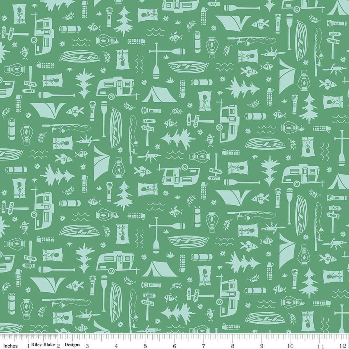 Image of Happy Haven Let's Camp Green quilting cotton fabric by Shawn Wallace for Riley Blake Designs. Features camping gear on a green background. Cute Little Fabric Shop.