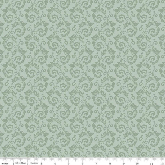 Image of Christmas Greetings Scroll Sage quilting cotton fabric by Sandy Gervais for Riley Blake Designs. Features swirls on a green background. Cute Little Fabric Shop.