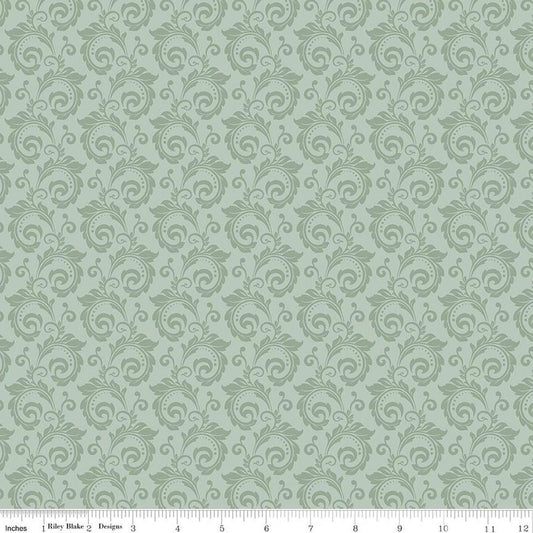 Image of Christmas Greetings Scroll Sage quilting cotton fabric by Sandy Gervais for Riley Blake Designs. Features swirls on a green background. Cute Little Fabric Shop.