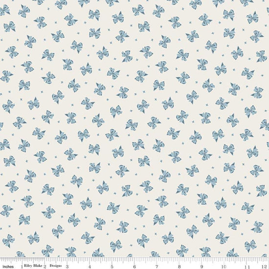 Image of Rosewood Petticoat Cream quilting cotton fabric by Jessica Chertkow for Riley Blake Designs. Features bows on a cream background. Cute Little Fabric Shop.