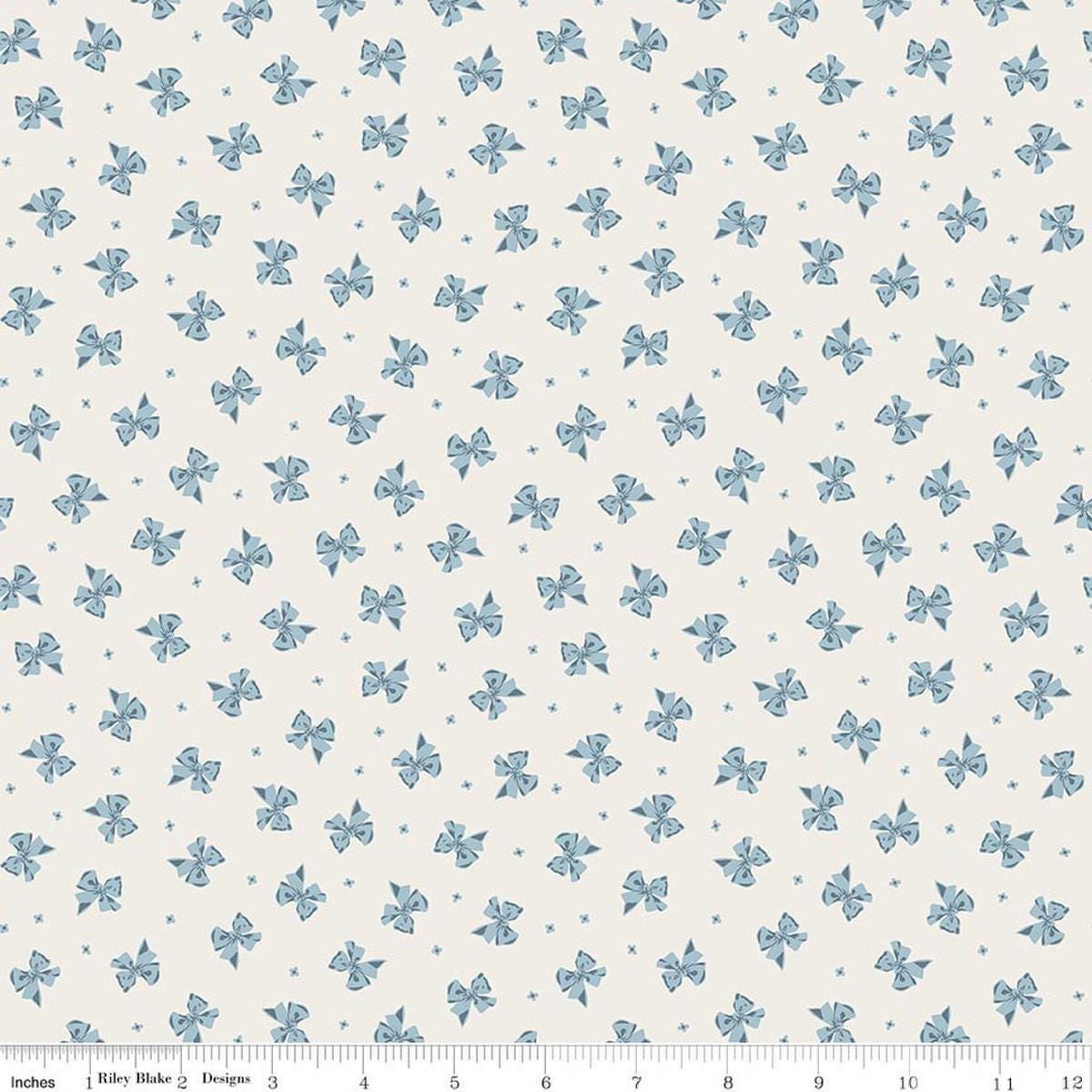 Image of Rosewood Petticoat Cream quilting cotton fabric by Jessica Chertkow for Riley Blake Designs. Features bows on a cream background. Cute Little Fabric Shop.