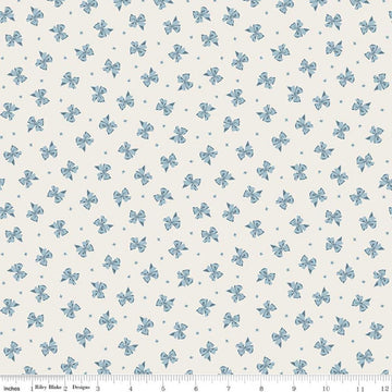Image of Rosewood Petticoat Cream quilting cotton fabric by Jessica Chertkow for Riley Blake Designs. Features bows on a cream background. Cute Little Fabric Shop.