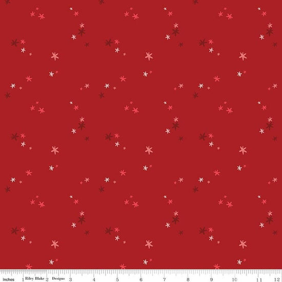 Image of Nutcracker Tradition Christmas Magic Berry quilting cotton fabric by Jennifer Long for Riley Blake Designs. Features stars on a red background. Cute Little Fabric Shop.