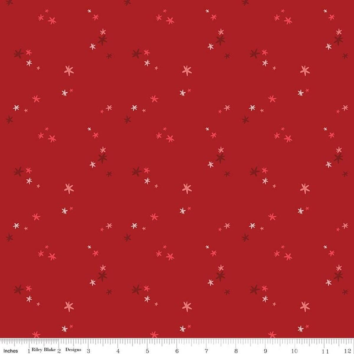 Image of Nutcracker Tradition Christmas Magic Berry quilting cotton fabric by Jennifer Long for Riley Blake Designs. Features stars on a red background. Cute Little Fabric Shop.