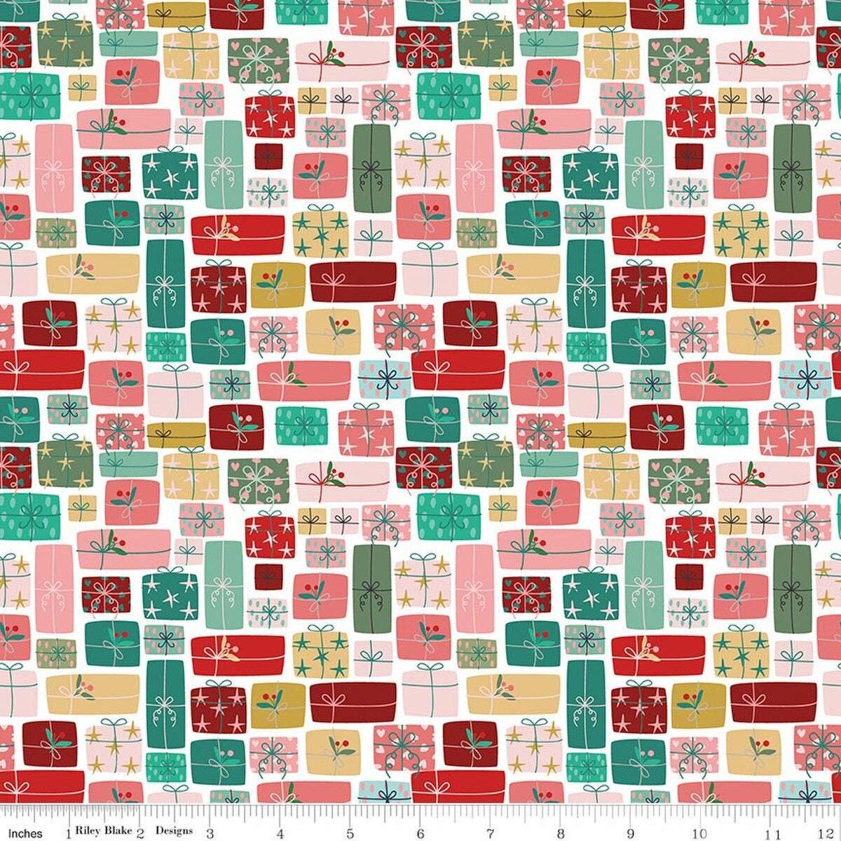 Image of Nutcracker Tradition Gifts of Giving Multi quilting cotton fabric by Jennifer Long for Riley Blake Designs. Features presents on a pink and blue background. Cute Little Fabric Shop.