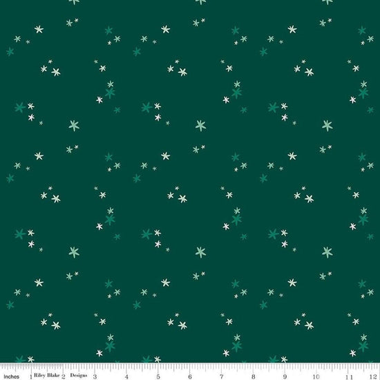 Image of Nutcracker Tradition Christmas Magic Pine quilting cotton fabric by Jennifer Long for Riley Blake Designs. Features stars on a green background. Cute Little Fabric Shop.