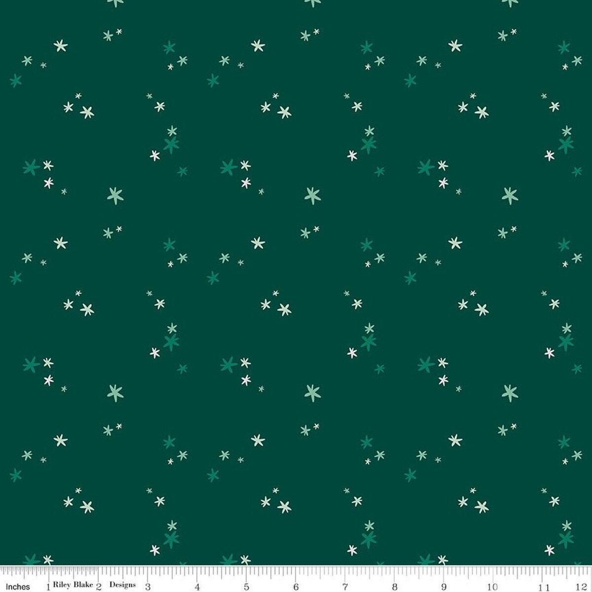 Image of Nutcracker Tradition Christmas Magic Pine quilting cotton fabric by Jennifer Long for Riley Blake Designs. Features stars on a green background. Cute Little Fabric Shop.