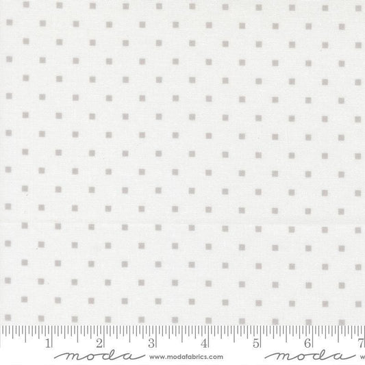 Image of A Cat Named Stitch Cosmo Cream Grey quilting cotton fabric by Camille Roskelley for Riley Blake Designs. Features polka dot squares on a cream background. Cute Little Fabric Shop.