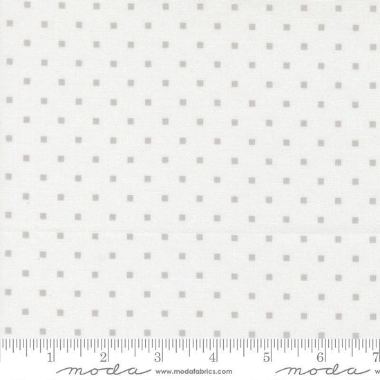 Image of A Cat Named Stitch Cosmo Cream Grey quilting cotton fabric by Camille Roskelley for Riley Blake Designs. Features polka dot squares on a cream background. Cute Little Fabric Shop.