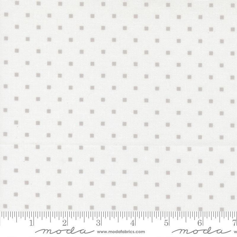Image of A Cat Named Stitch Cosmo Cream Grey quilting cotton fabric by Camille Roskelley for Riley Blake Designs. Features polka dot squares on a cream background. Cute Little Fabric Shop.