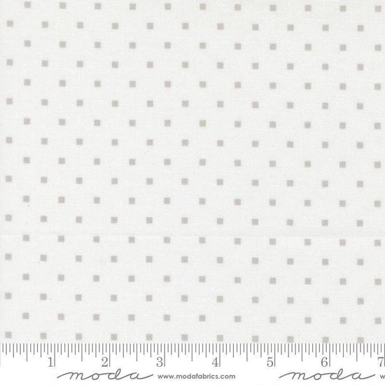 Image of A Cat Named Stitch Cosmo Cream Grey quilting cotton fabric by Camille Roskelley for Riley Blake Designs. Features polka dot squares on a cream background. Cute Little Fabric Shop.
