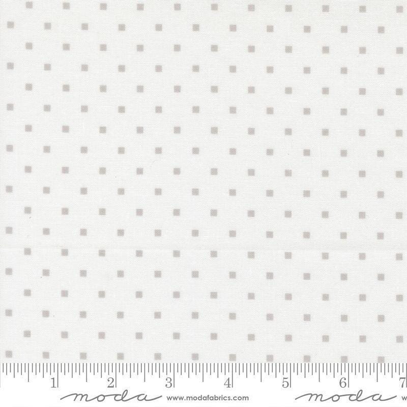 Image of A Cat Named Stitch Cosmo Cream Grey quilting cotton fabric by Camille Roskelley for Riley Blake Designs. Features polka dot squares on a cream background. Cute Little Fabric Shop.