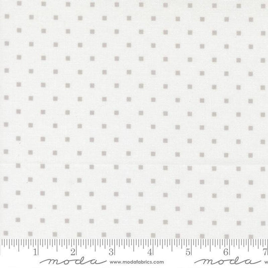 Image of A Cat Named Stitch Cosmo Cream Grey quilting cotton fabric by Camille Roskelley for Riley Blake Designs. Features polka dot squares on a cream background. Cute Little Fabric Shop.