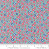 Image of A Cat Named Stitch Lucky Sky quilting cotton fabric by Camille Roskelley for Riley Blake Designs. Features flowers on a blue background. Cute Little Fabric Shop.