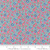 Image of A Cat Named Stitch Lucky Sky quilting cotton fabric by Camille Roskelley for Riley Blake Designs. Features flowers on a blue background. Cute Little Fabric Shop.