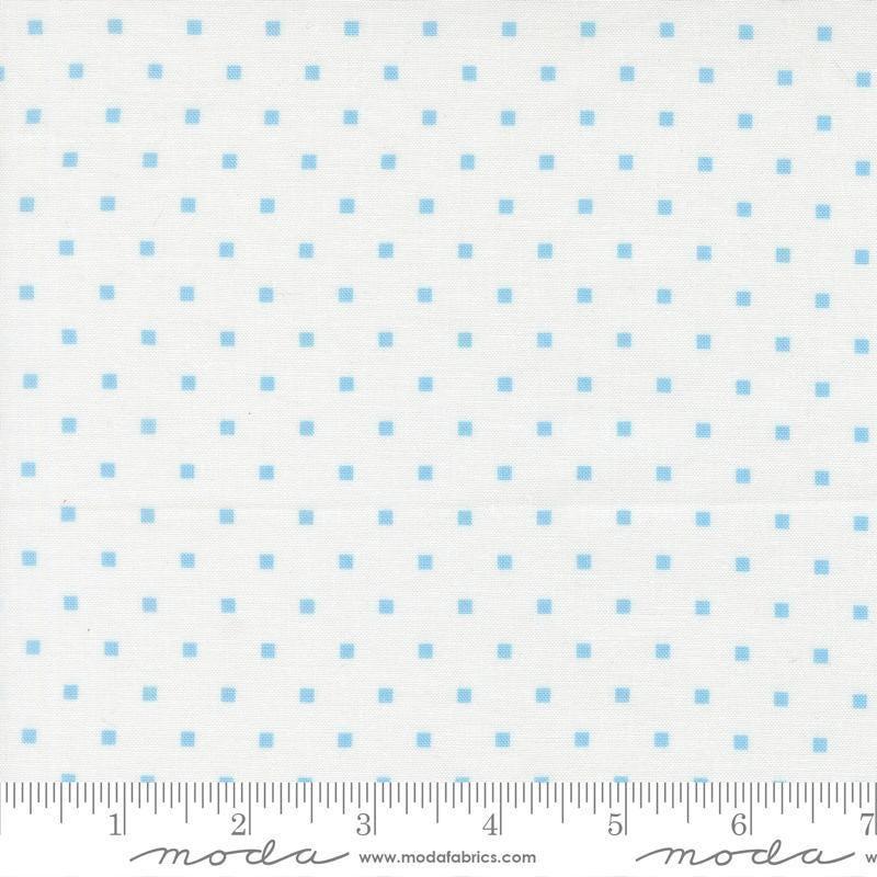 Image of A Cat Named Stitch Cosmo Cream Sky quilting cotton fabric by Camille Roskelley for Riley Blake Designs. Features polka dot squares on a cream background. Cute Little Fabric Shop.